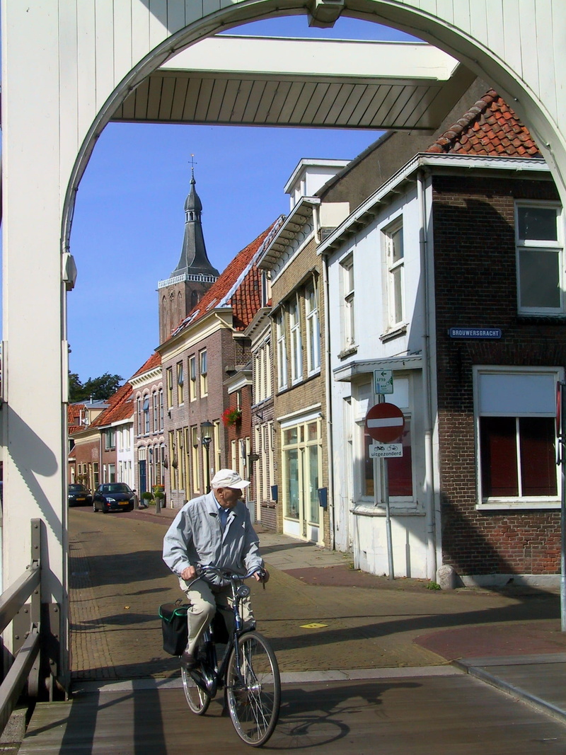 lifestyles, architecture, church tower, men, mode of transportation, street scene, building, 1080P, overijssel, riding, ride, land vehicle, one person