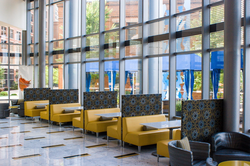 large group of objects, restaurant, empty, business, table, absence, city view, seat, building, arrangement, indoors, grand rapids, windows, furniture