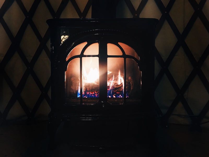 lighting equipment, wall - building feature, fire, stove, metal, building, indoors, warm, architecture, flame, wood, wood burning, hot, electric lamp, burning