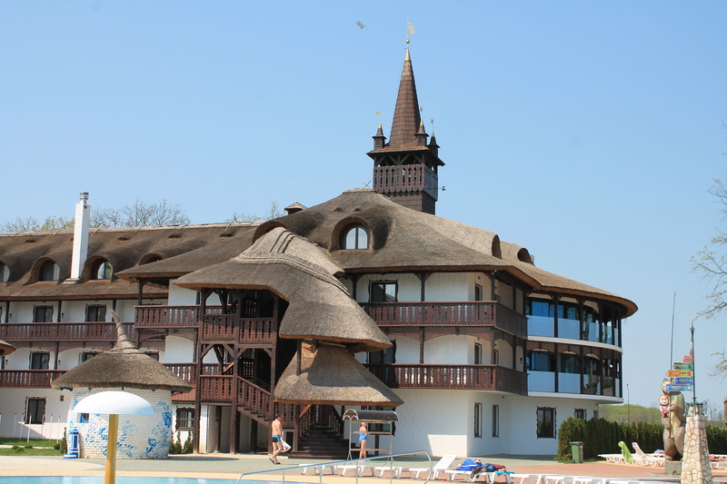 city, resort hotel, low angle view, religion, kosino, sky, tower, day, place of worship, transcarpathia, incidental people, sunny day, spire, ukraine, travel