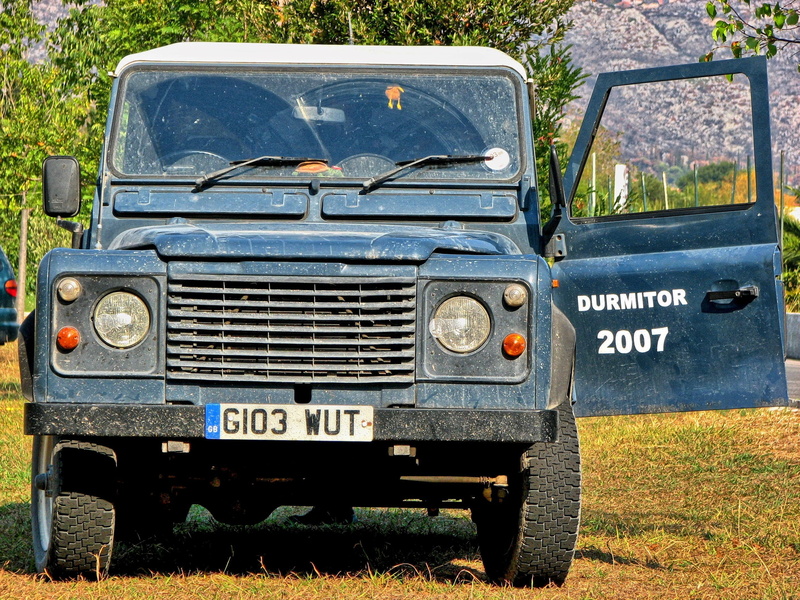 road, 4 x 4, metal, blue, land rover, text, stationary, day, no people, land, off roader, sunlight, outdoors, motor vehicle, transportation, obsolete, white
