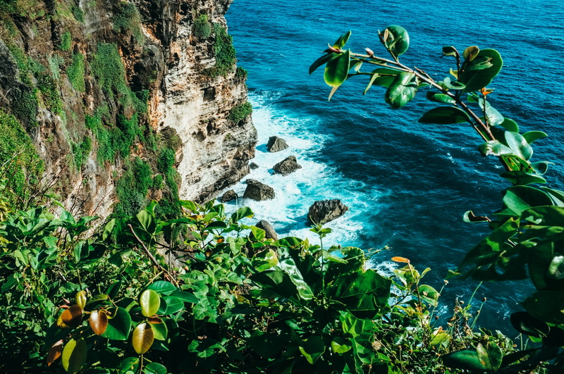 seascape, beauty in nature, green color, uluwatu temple, waves, no people, rock - object, cliff, day, bali, solid, green, plant part, turquoise colored