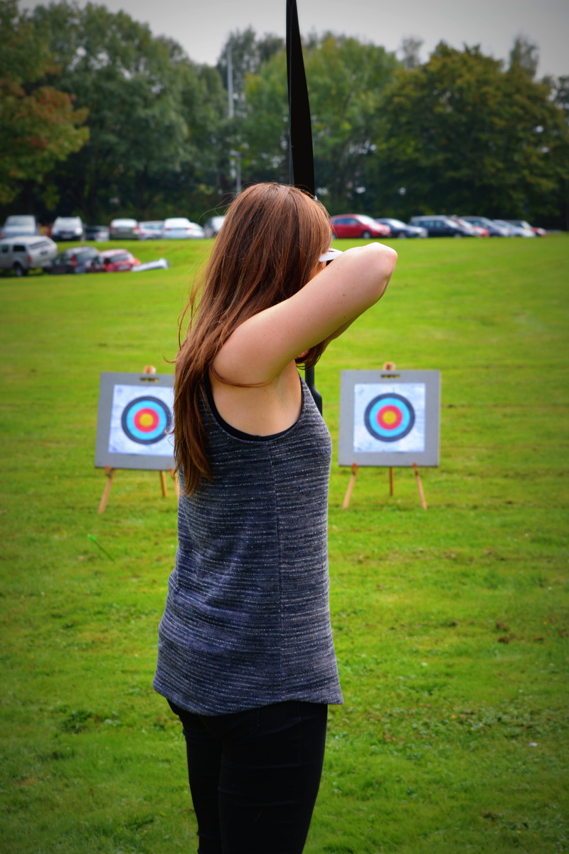 real people, Archery, People, lifestyles, one person, target, Woman, day, plant, concentration, daytime, standing, green color, grass, rear view, shots