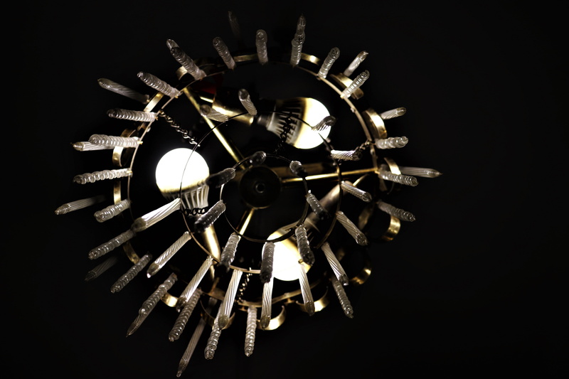 light fixture, technology, bronze, electricity, lamp, illuminated, studio shot, dark, close-up, wall clock, steering wheel, chandelier, analog clock, 5K