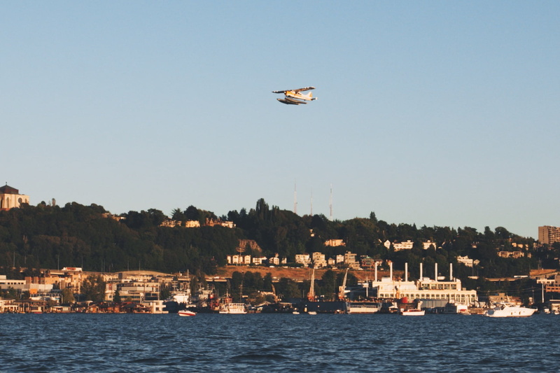 built structure, cityscape, sky, water, day, monoplane, sea, building exterior, no people, 720P, blue, city, buildings, harbor, coast, nautical vessel