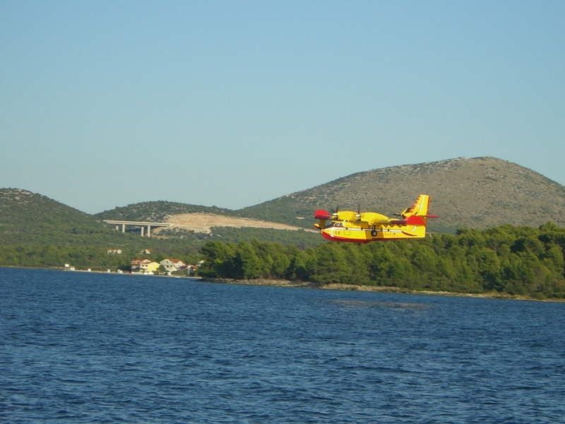 day, waterfront, sea, transportation, clear sky, blue, copy space, fire, use, aircraft, mountain, 1080P, beauty in nature, air vehicle, no people, nature