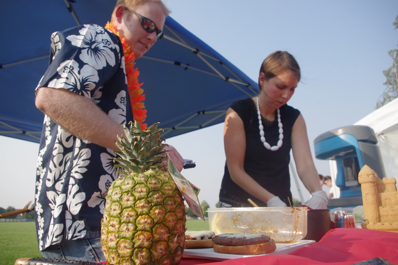 front view, real people, pineapple, standing, occupation, holding, adult, men, casual clothing, three quarter length, males, food and drink, nature, day