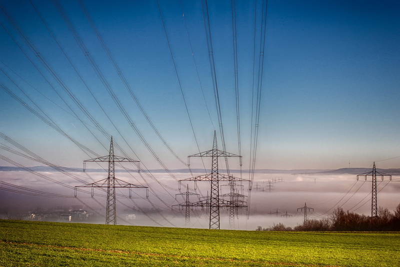 tranquility, haze, landscape, cable, performance, field, land, strommast, current, power line, sky, industry, power cable, nature, green, beauty in nature