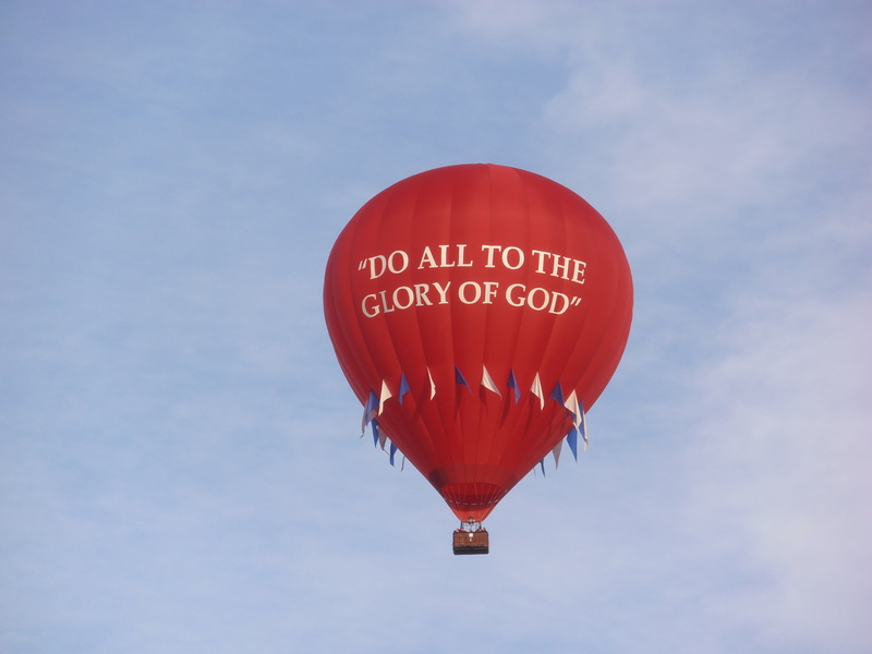 no people, red, day, low angle view, air, nature, western script, text, hot air balloon, flying, communication, sign, low, transportation, sky, balloon
