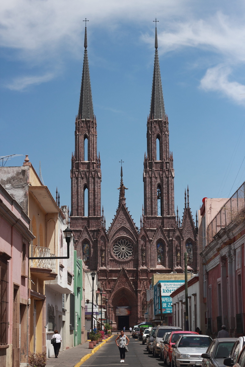 built structure, spire, place of worship, zamora, motor vehicle, street, building, land vehicle, outdoors, church, sky, tower, religion, transportation