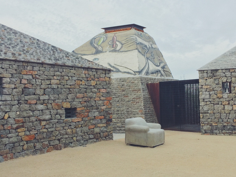 clos de tres cantos, representation, valle de guadalupe, built structure, human representation, stone material, vineyards, architecture, sky, mexico, day