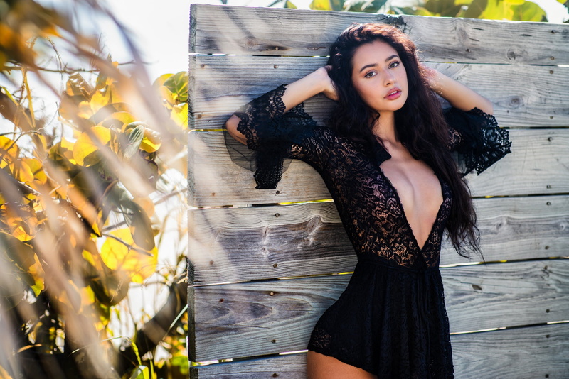breast, long hair, lace, photo, 1080P, wood, portrait, looking at viewer, juicy lips, lips, face, looking at camera, cleavage, hands in hair, black dress