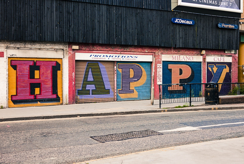 western script, food, pedestrian, happy, creativity, london, communication, sign, road, alphabet, nature, wall - building feature, footpath, architecture