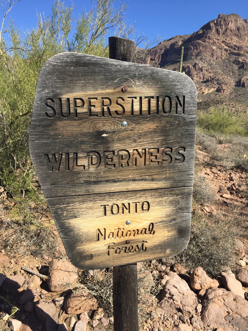 information sign, warning sign, non-urban scene, tonto, rock, arrow symbol, day, national forest, desert, text, phoenix, no people, solid, southwest, travel destinations