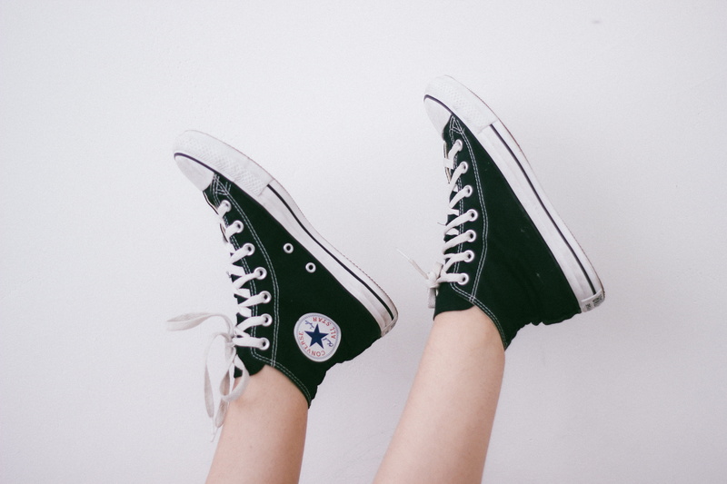 footwear, white, high, holding, unrecognizable person, black, human limb, nature, white background, adult, shoes, star, wearing, women, 5K, sneakers, one person
