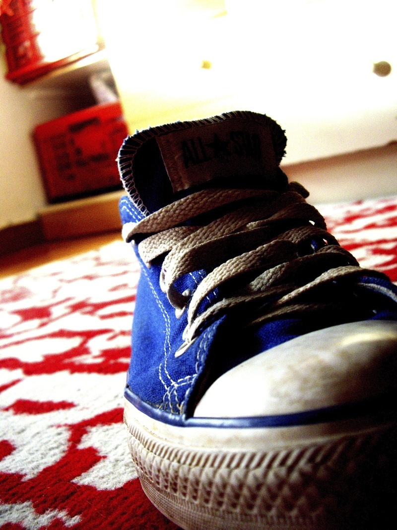 home interior, personal accessory, focus on foreground, shoe, converse, table, mat, furniture, shoelace, indoors, pattern, shoes, still life, textile, everyday life