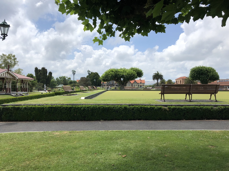 overcoat, cloud - sky, beauty in nature, park bench, grass, green color, 4K, hedge, tree trunk, apparel, tree, built structure, bench, architecture, 1061 haupapa st