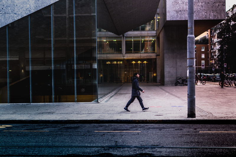 women, built structure, outdoors, person, motion, office building, asphalt, sport, real people, skill, full length, architecture, apparel, lifestyles, side view