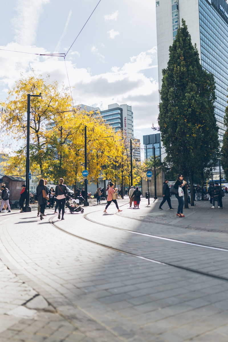 tarmac, human, architecture, sky, adult, plant, men, built structure, urban, city, city life, building, pedestrian, street, building exterior, people, manchester
