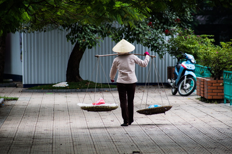 hat, footwear, paving stone, apparel, rear view, land vehicle, 5K, footpath, day, one person, wheel, asian style conical hat, two, person, grey, path