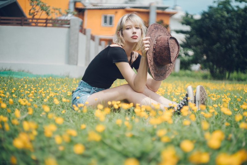 jean shorts, women with hats, black tops, 1080P, looking at viewer, women, model, women outdoors, sitting, Converse, portrait, yellow flowers, flowers