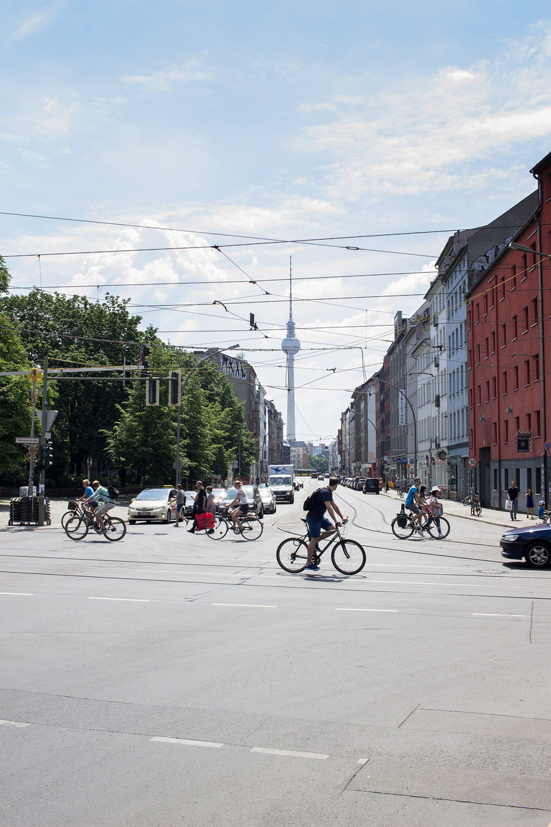 cloud - sky, tv tower, land vehicle, architecture, city, u rosenthaler platz (berlin), bicycle, built structure, plant, cityscape, urban, outdoors, street