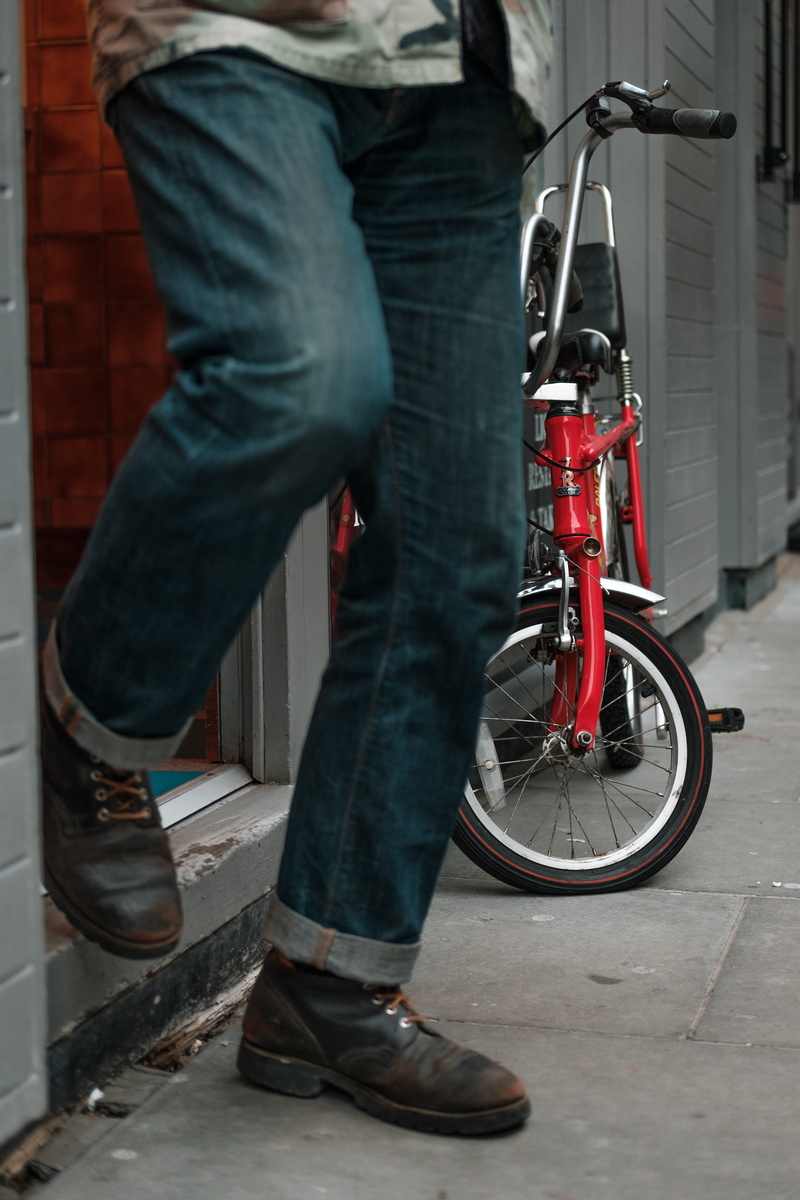 shoe, architecture, human leg, one person, casual clothing, body part, bicycle, transportation, real people, lifestyles, 4K, city, outdoors, street, soho