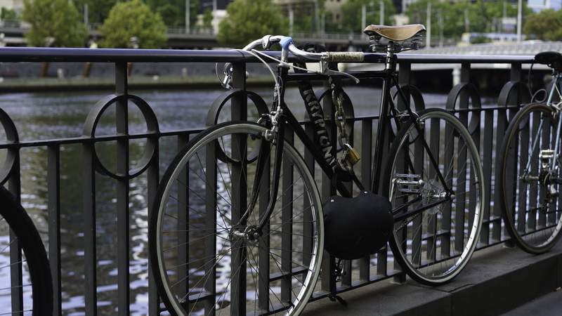 5K, city, connection, parking, focus on foreground, close-up, architecture, parking lot, bicycle rack, bycicle, metal, bicycle, mode of transportation