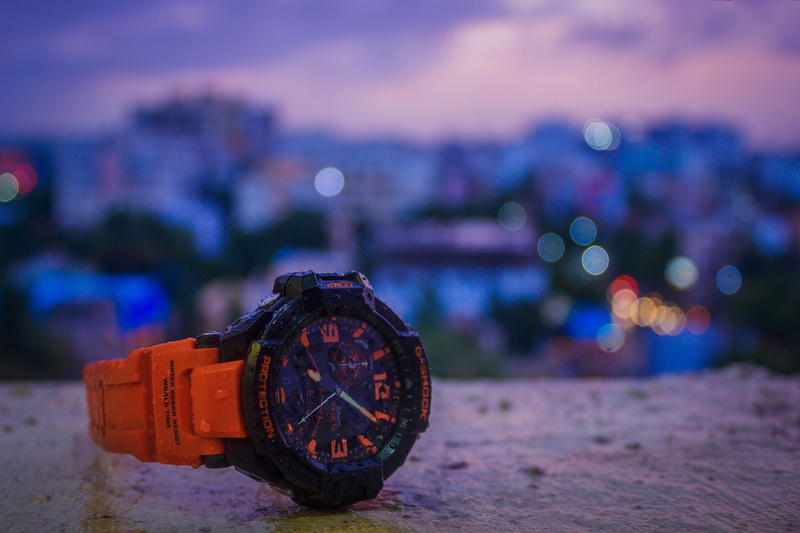 close-up, nature, no people, g shock, time, watch, geometric shape, focus on foreground, 5K, building exterior, wheel, casio, sky, cityscape, india, architecture