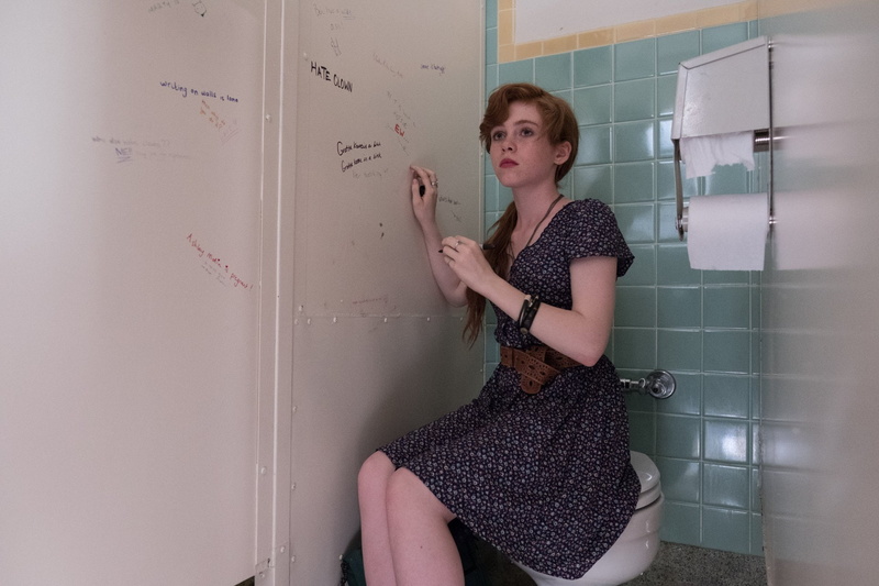 adult, indoors, women, board, fashion, casual clothing, contemplation, hair, Sophia Lillis, standing, holding, three quarter length, hairstyle, young women