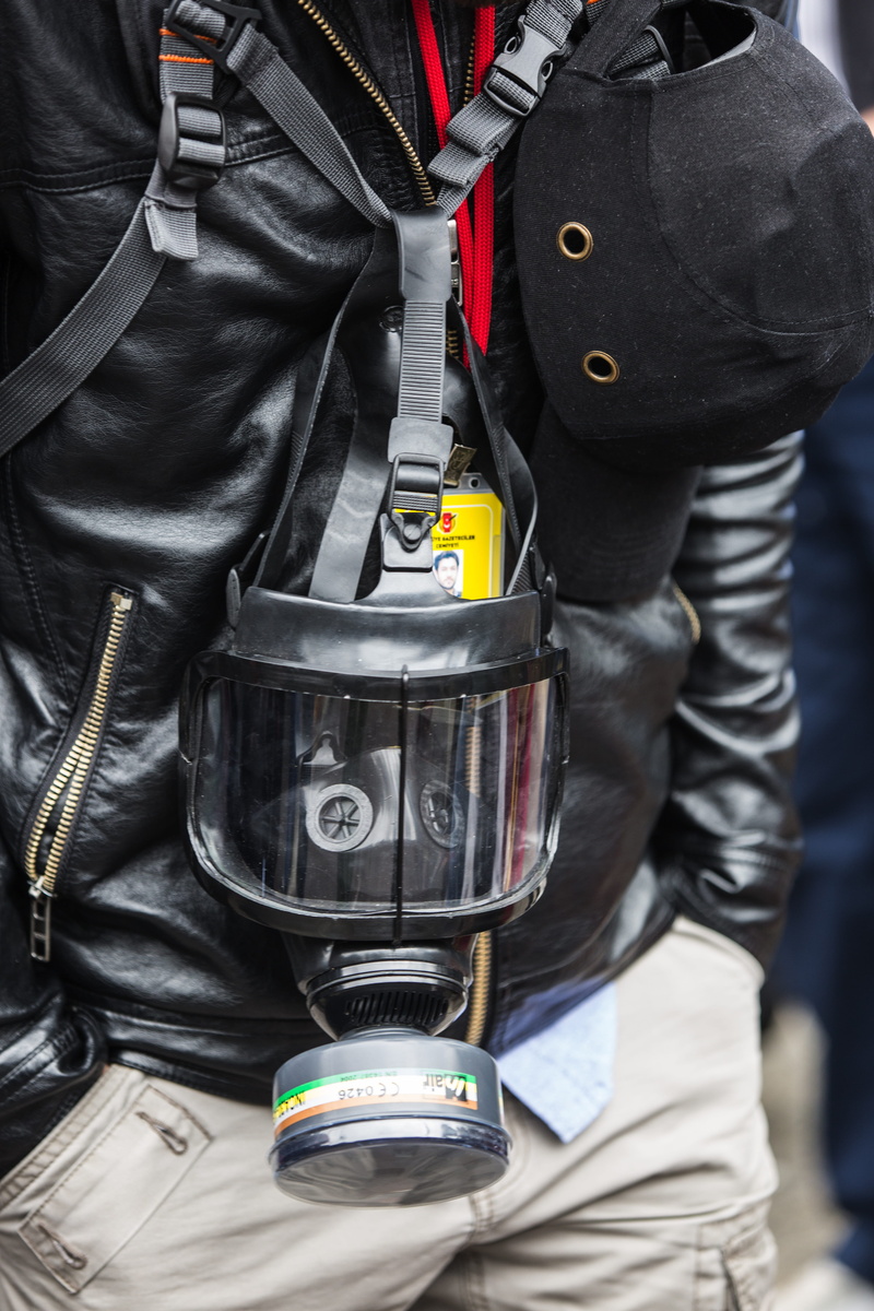 helmets, uniform, journalist, concepts, midsection, portrait, contact, attack, holding, outdoors, exposure, real people, gas bombs, clothing, helmet, men