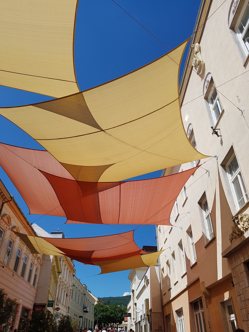 downtown, pattern, building, sail, clear sky, nature, pecs, built structure, sky, 4K, hungary, hanging, city, low angle view, decoration, street, blue