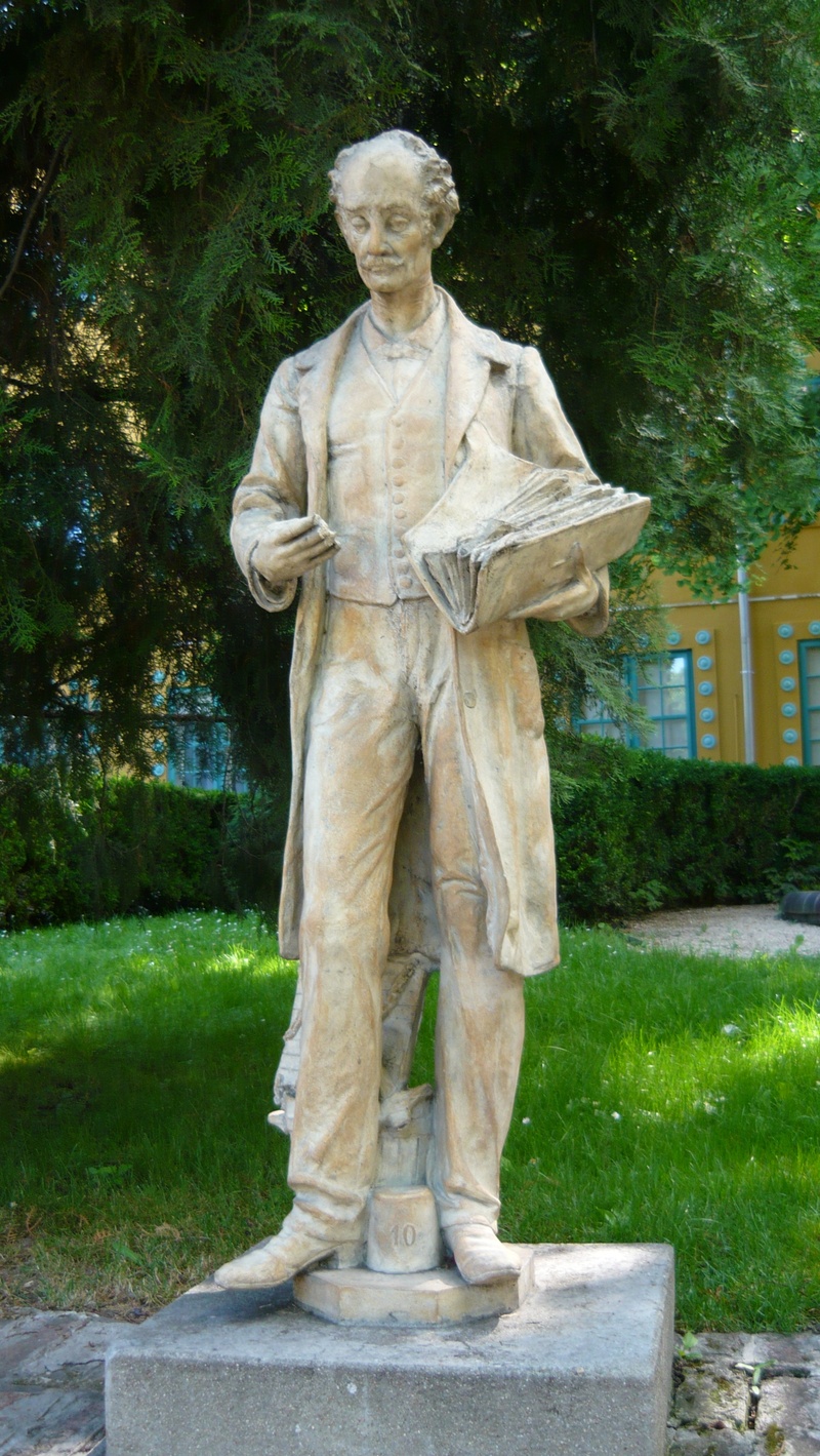 park - man made space, day, zsolnay, stone material, pecs, nature, tree, male likeness, grass, park, full length, the past, statue, hungary, representation