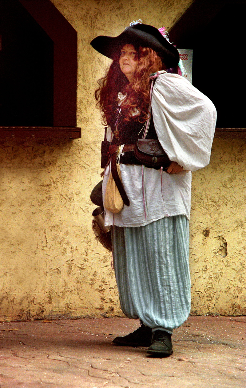 females, one man only, lifestyles, males, walking, Pants, full length, architecture, wall - building feature, cultures, Woman, large, standing, one Person