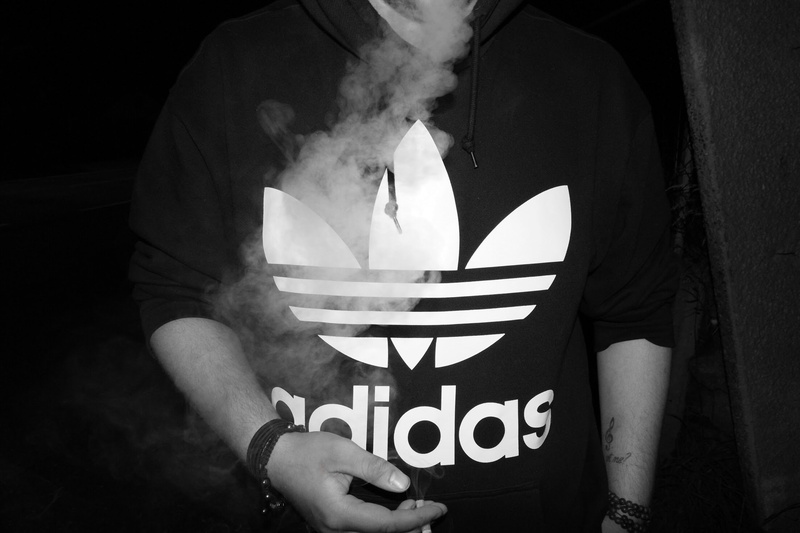 front view, one person, black, men, real people, casual clothing, holding, 1080P, hand, human body part, human hand, Adidas, religion, indoors, monochrome