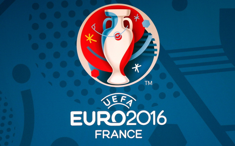 text, blue, 2K, geometric shape, security, western script, Football, focus on foreground, close-up, red, no people, indoors, representation, circle, communication