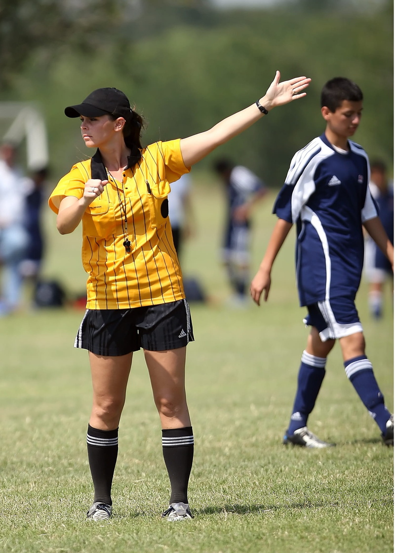 left, penalty, rising, grass, motion, open, yellow, full length, competition, soccer uniform, green, child, focus on foreground, whistle, sport, lifestyles