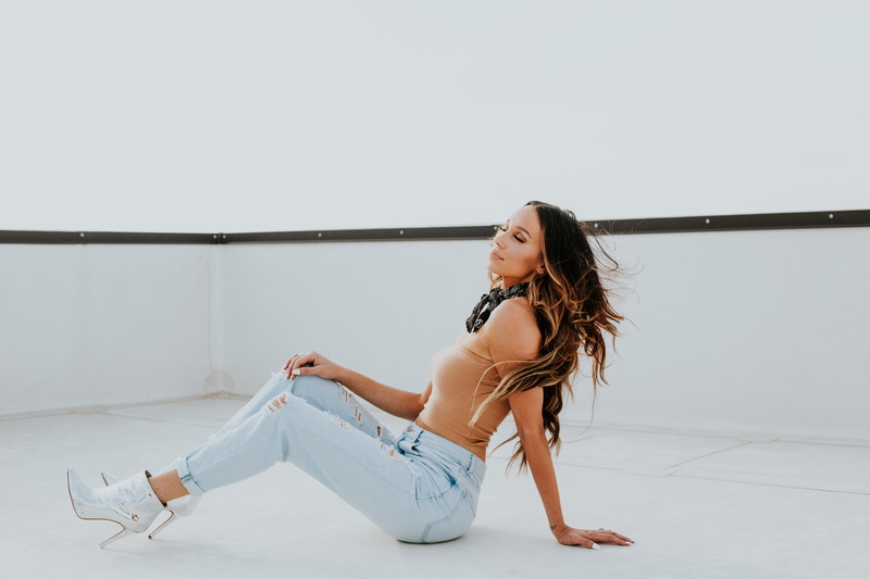 white, view, young women, jeans, brown, beautiful woman, ripped jeans, teenager, tone, one person, atlien, side view, hair, beauty, woman, adult, sitting
