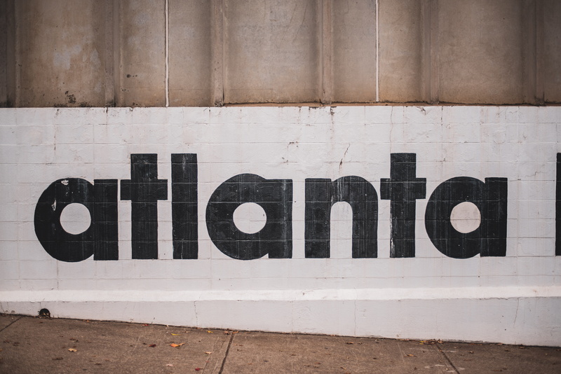 white color, single word, western script, communication, mural, word, atlanta, day, wood - material, capital letter, coat, wall - building feature, atl