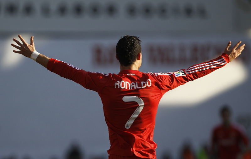 one person, human arm, men, human limb, rear view, standing, focus on foreground, player, s, ronaldo, real Madrid, real people, day, mega star, limb, 2K