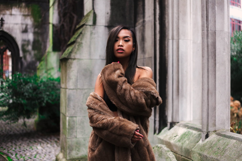 young adult, architecture, looking at camera, fur coats, outdoors, contemplation, hairstyle, standing, day, one person, 720P, women outdoors, beautiful woman