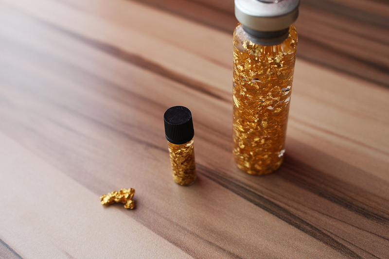 natural gold, indoors, high angle view, healthcare and medicine, dose, drink, sunlight, food and drink, nutritional supplement, table, refreshment, wood grain