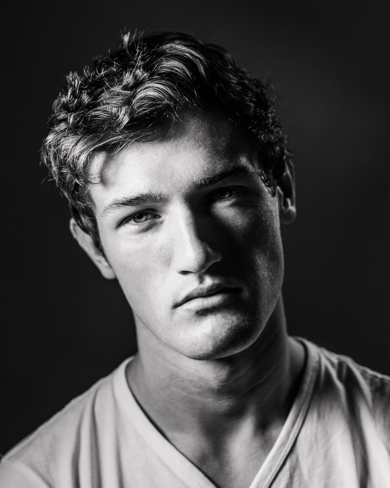 photography, casual clothing, serious, confidence, fine-looking, headshot, monochrome photography, black and white, black background, one person, men, grayscale