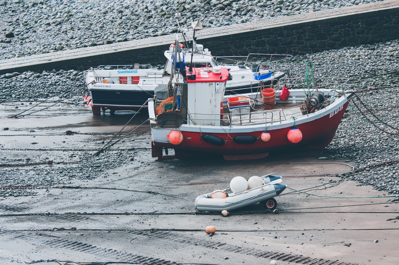 no people, watercraft, hovercraft, water, sunlight, shore, cold temperature, port, barge, person, outdoors, nautical vessel, vehicle, two, fishing industry