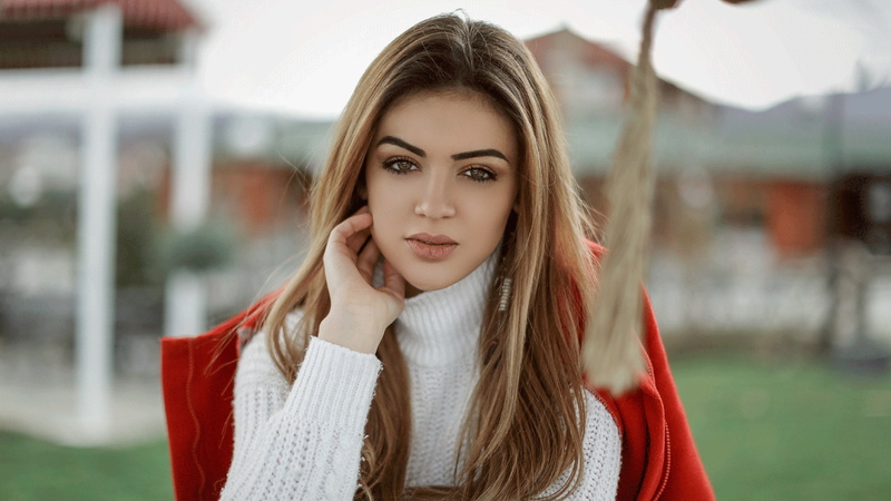 orange jacket, juicy lips, lips, 1080P, looking at viewer, coast, face, eyebrows, depth of field, women, portrait, touching face, white sweater