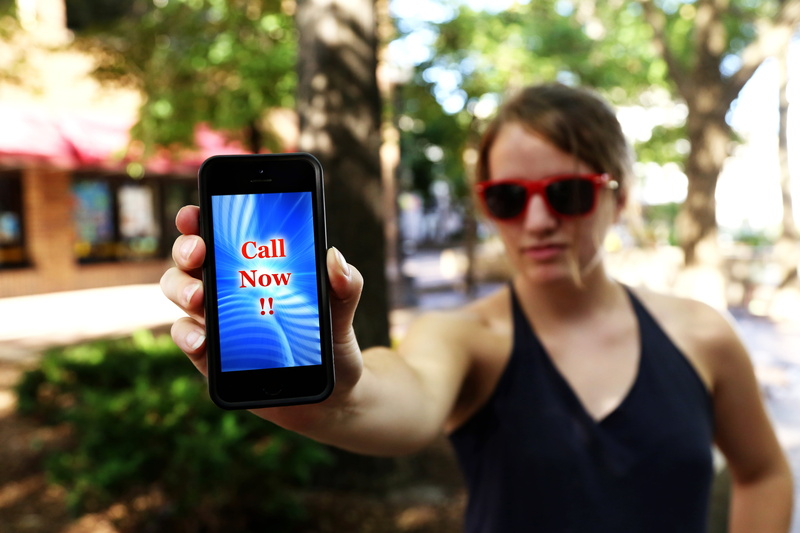 young adult, people, girl, telephone, woman, now, portable information device, mobile phone, cell phone, shirt, smart phone, message, v-neck shirt, focus on foreground