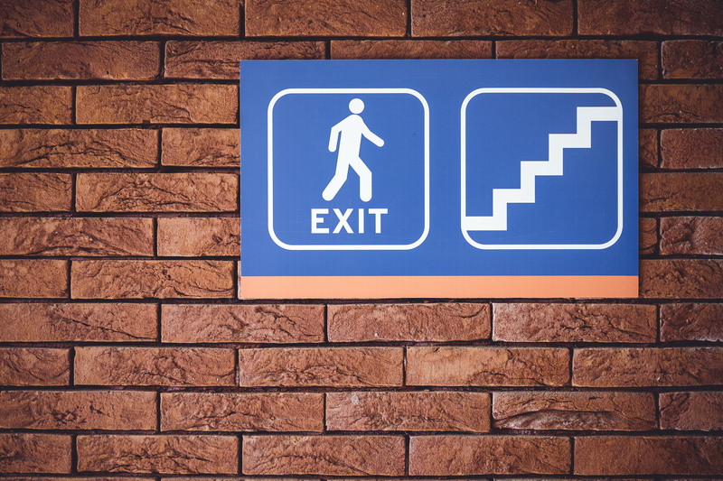 wall - building feature, brown, human representation, public restroom, brick, guidance, information sign, stair, restroom sign, building exterior, 5K