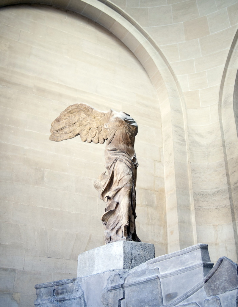 male likeness, sculpture, outdoors, communication award, arch, nike, craft, architectural column, representation, Louvre, the louvre, built structure, monument