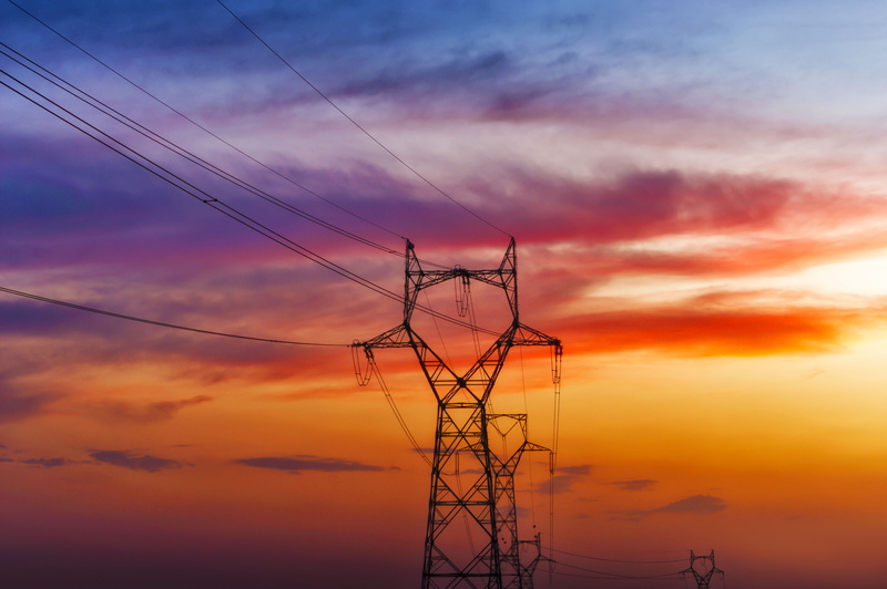 fuel and power generation, tranquility, sky colors, sunset, low angle view, electricity towers, connection, orange color, cloud - sky, electrical component