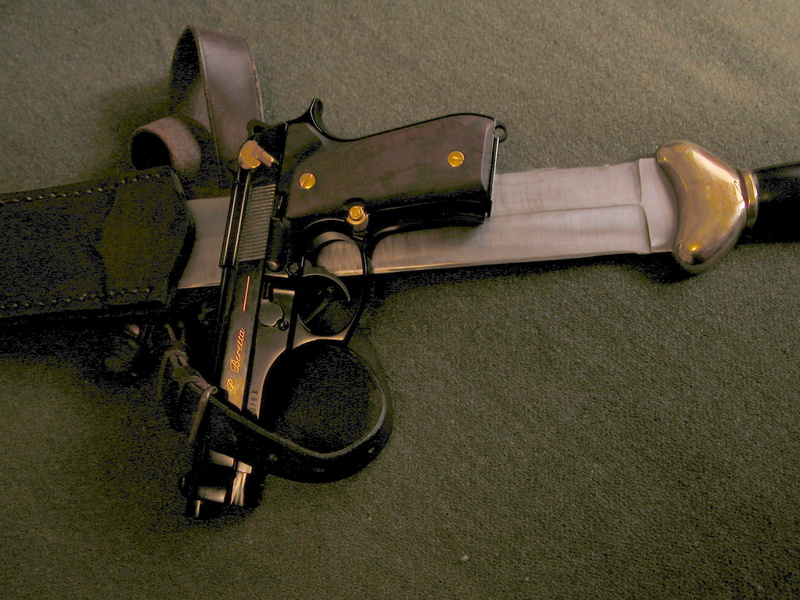 aggression, antique, indoors, gun, metal, two objects, beretta pistol, old, weapon, single object, still life, high angle view, retro styled, lying down